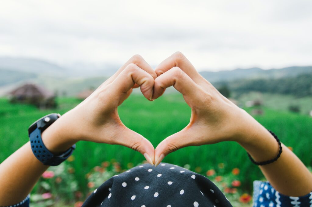 hands in shape of love heart